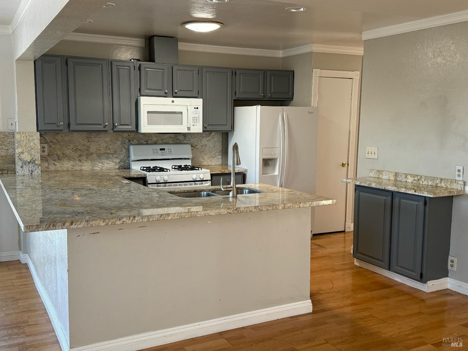 631 Inverness Drive Vallejo, CA 94589 - Photo 3 of 18 a kitchen with stainless steel appliances granite countertop a sink a stove and a refrigerator