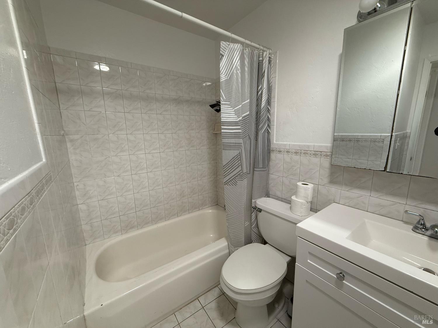 631 Inverness Drive Vallejo, CA 94589 - Photo 9 of 18 a bathroom with a sink toilet and shower