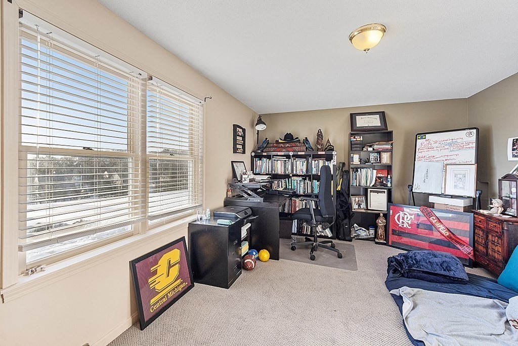 84 Century Way, Unit 84 Gardner, MA 01440 - Photo 19 of 28 a view of a livingroom with workspace and a window