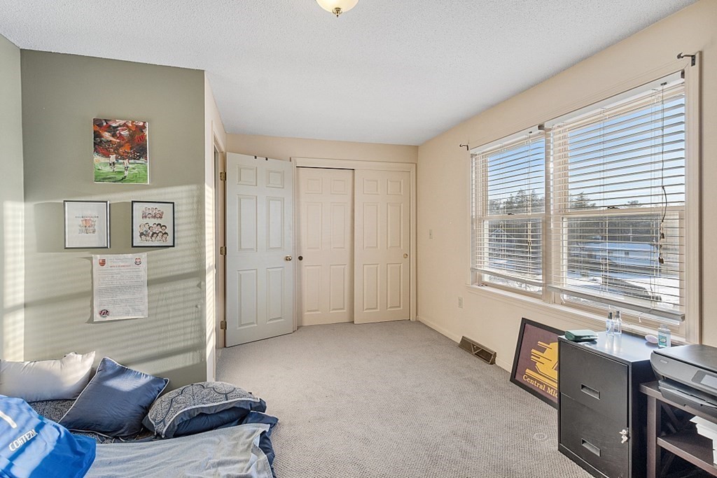 84 Century Way, Unit 84 Gardner, MA 01440 - Photo 20 of 28 a living room with furniture and a window