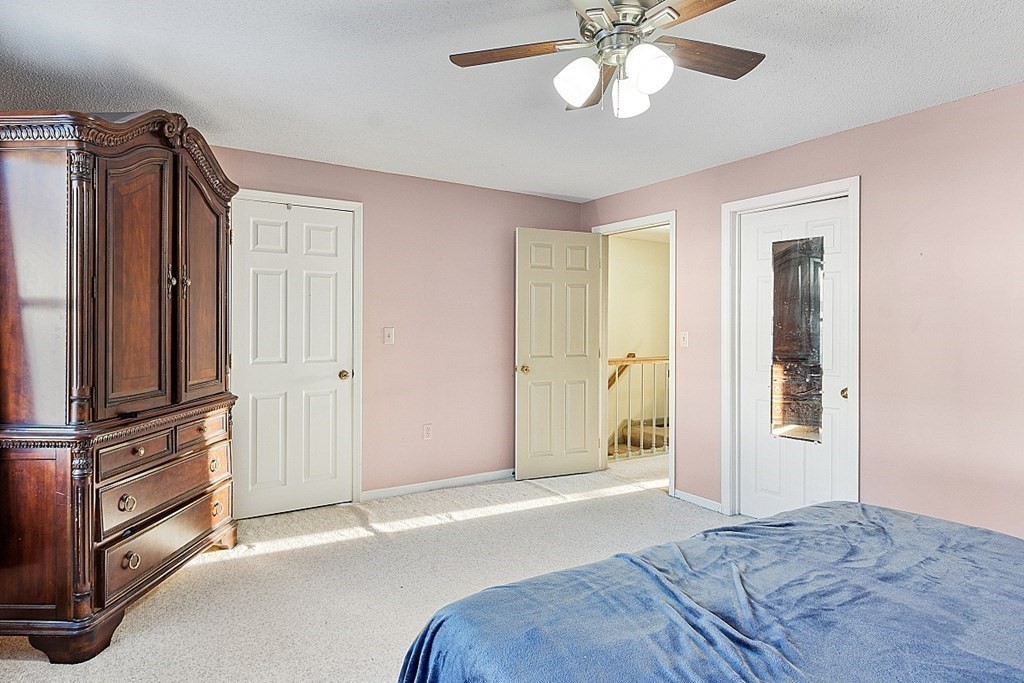 84 Century Way, Unit 84 Gardner, MA 01440 - Photo 22 of 28 a bedroom with a bed dresser and a window
