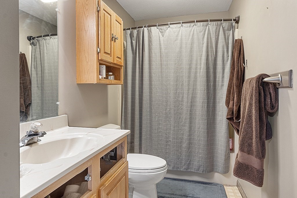 84 Century Way, Unit 84 Gardner, MA 01440 - Photo 23 of 28 a bathroom with a sink toilet and shower