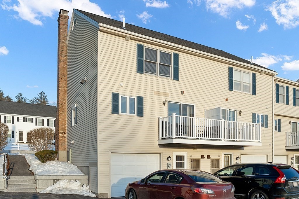 84 Century Way, Unit 84 Gardner, MA 01440 - Photo 26 of 28 a couple of cars parked in front of a building