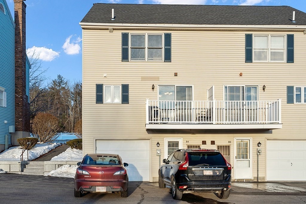 84 Century Way, Unit 84 Gardner, MA 01440 - Photo 27 of 28 a car parked in front of a house
