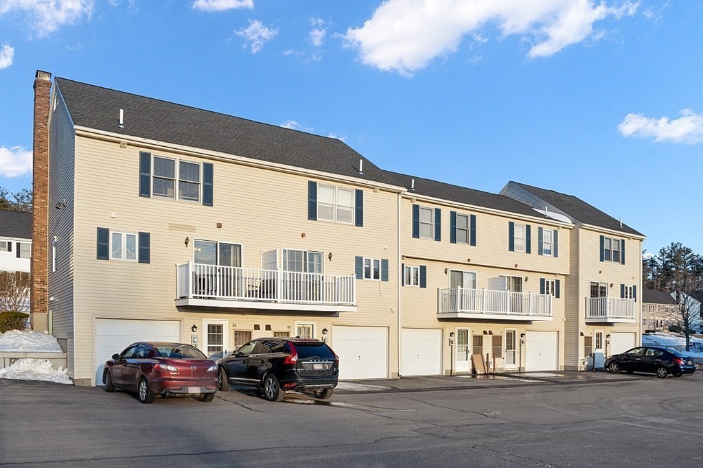 84 Century Way, Unit 84 Gardner, MA 01440 - Photo 28 of 28 a car parked in front of a building