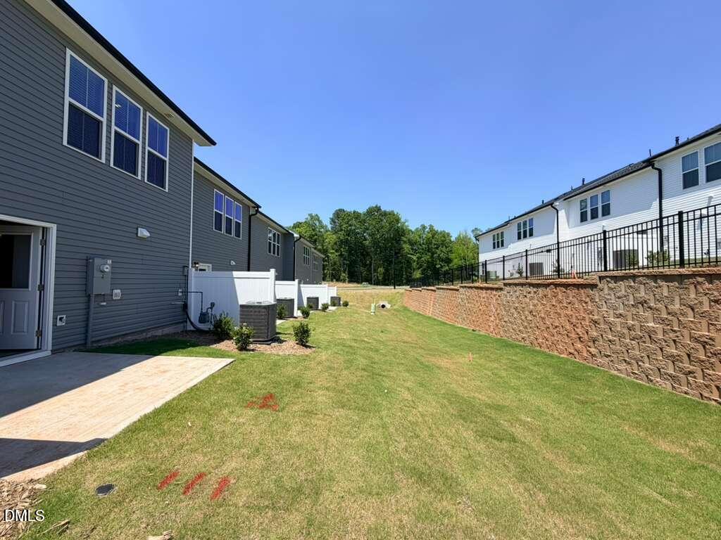 5024 Reader Way Durham, NC 27703 - Photo 24 of 26 a backyard of a house with table and chairs