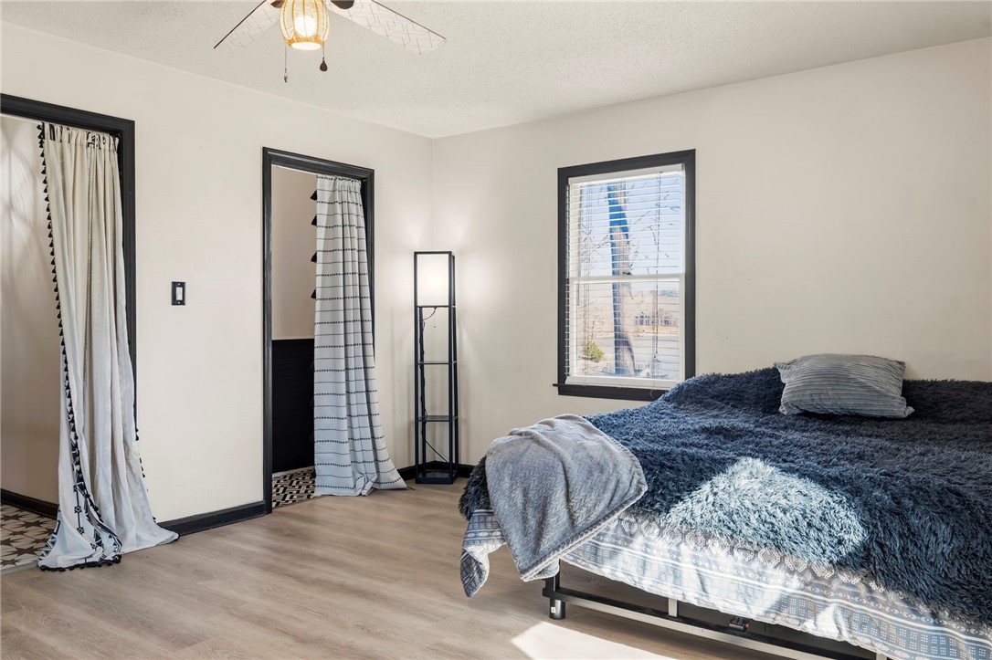 122 Latham Drive Anderson, SC 29621 - Photo 16 of 40 This cozy bedroom features light wood flooring and a refreshing ceiling fan.