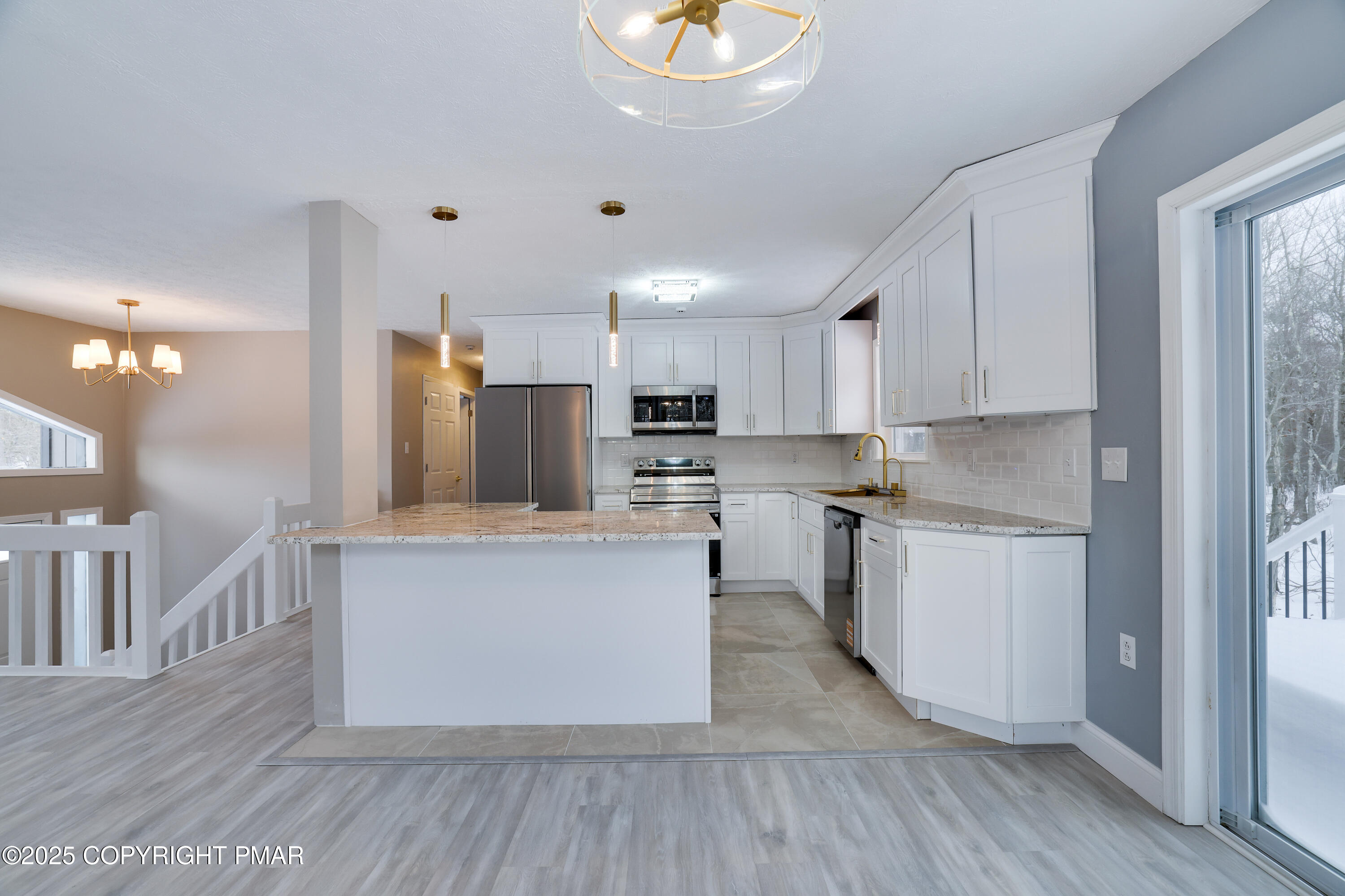 1254 Winding Way Tobyhanna, PA 18466 - Photo 12 of 46 a kitchen with granite countertop a stove top oven and cabinets
