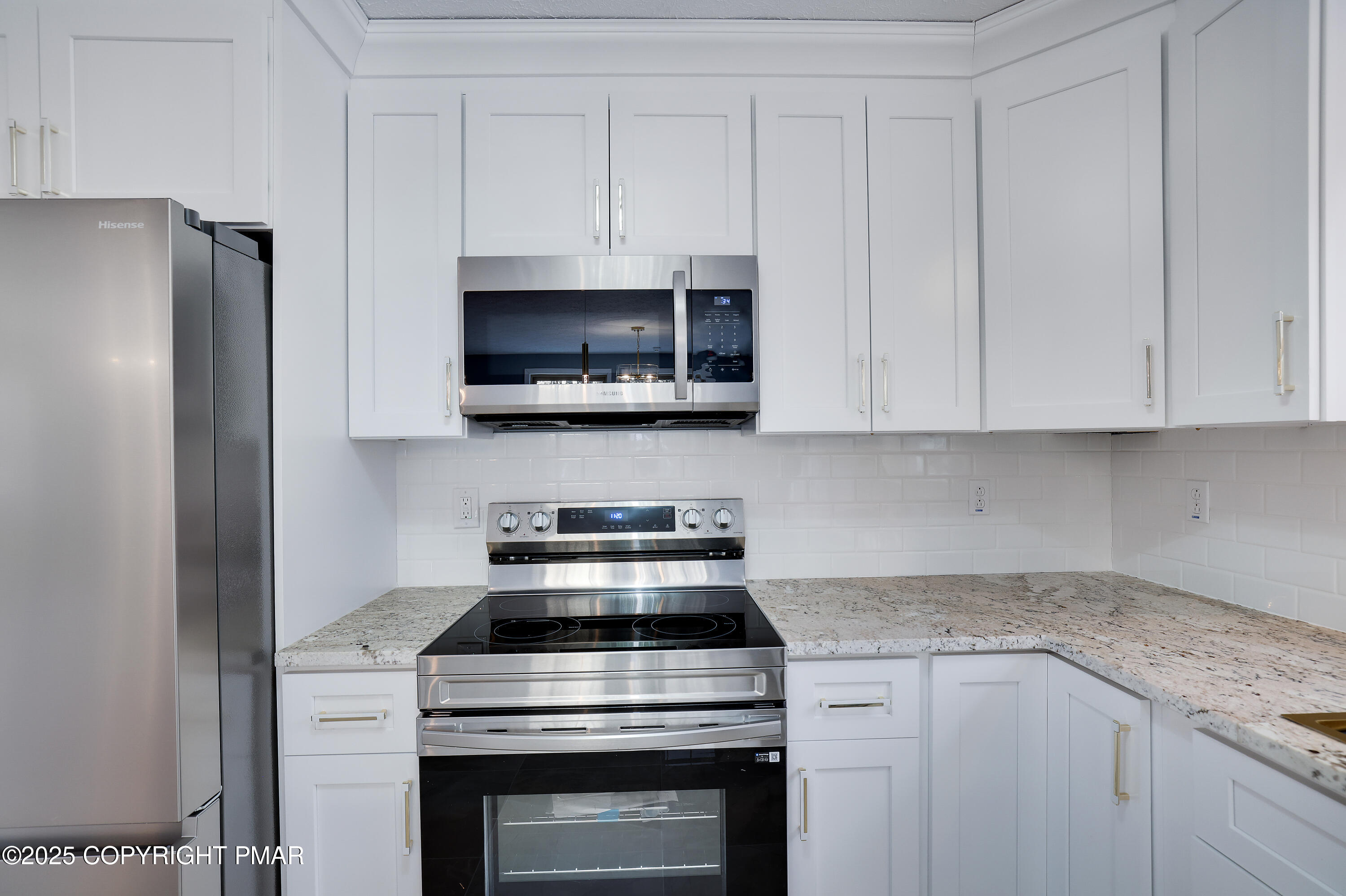 1254 Winding Way Tobyhanna, PA 18466 - Photo 15 of 46 a kitchen with stainless steel appliances granite countertop white cabinets and a stove a refrigerator with white cabinets