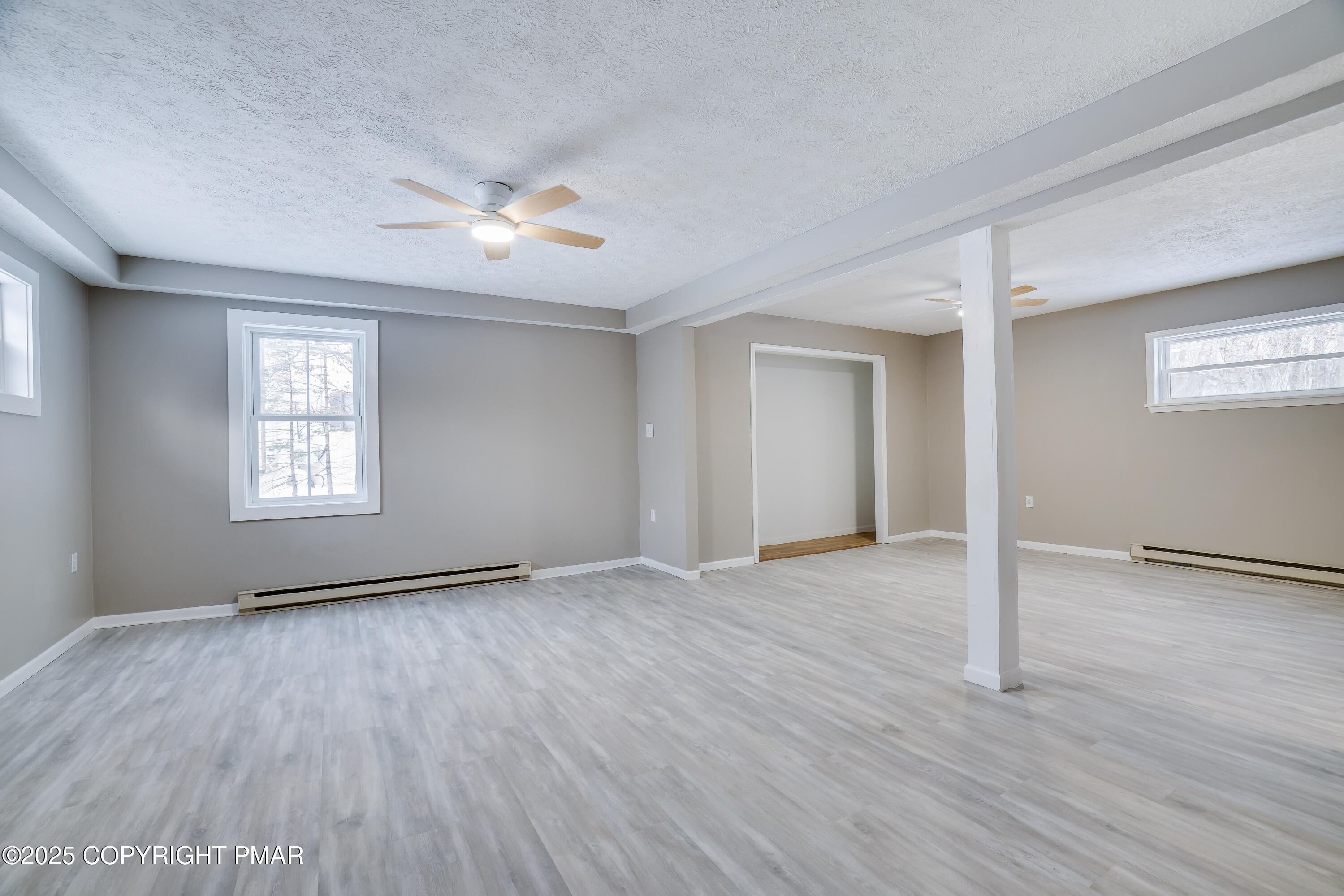 1254 Winding Way Tobyhanna, PA 18466 - Photo 28 of 46 a view of an empty room with wooden floor and a window