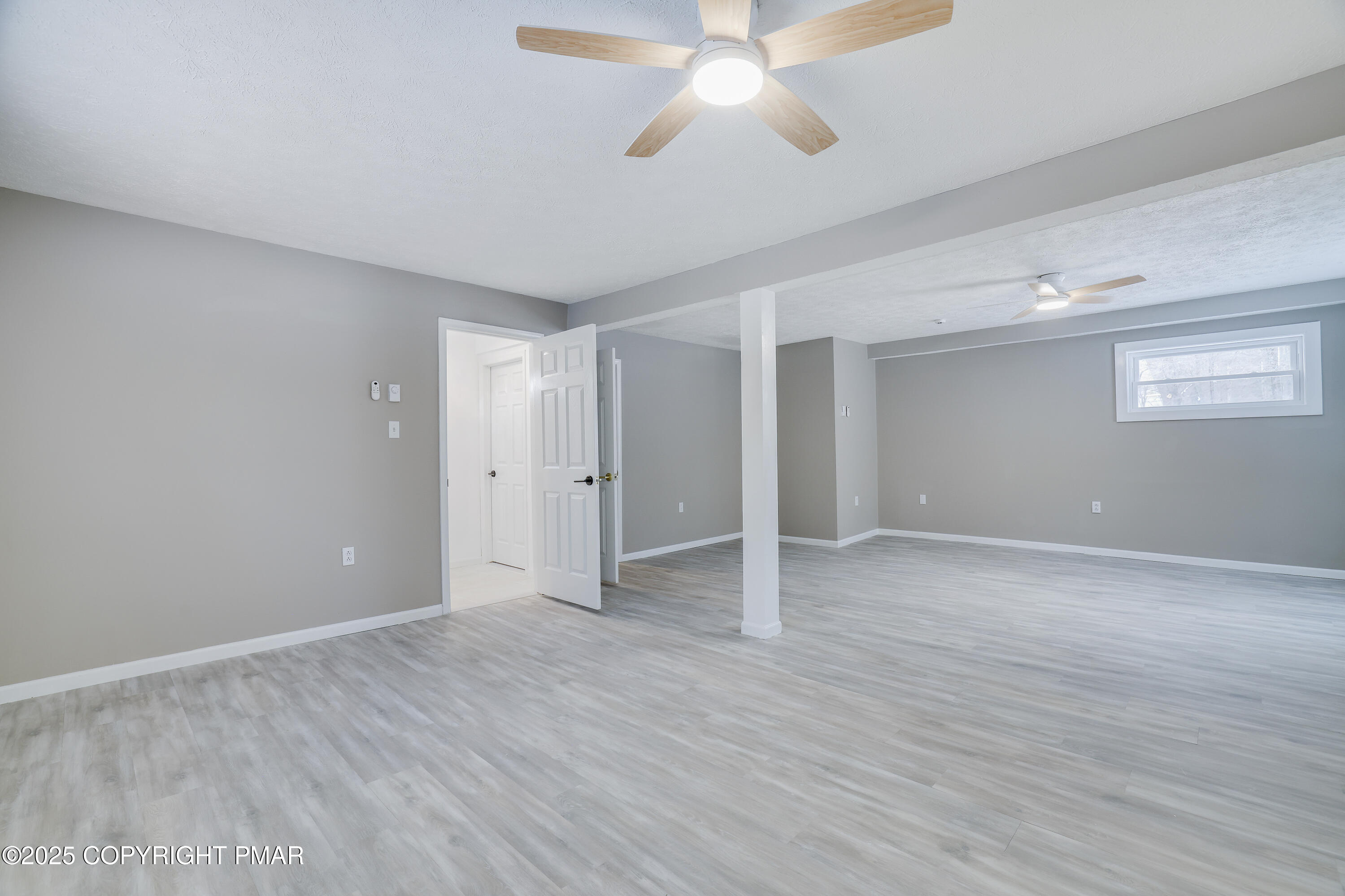 1254 Winding Way Tobyhanna, PA 18466 - Photo 29 of 46 a view of an empty room with wooden floor