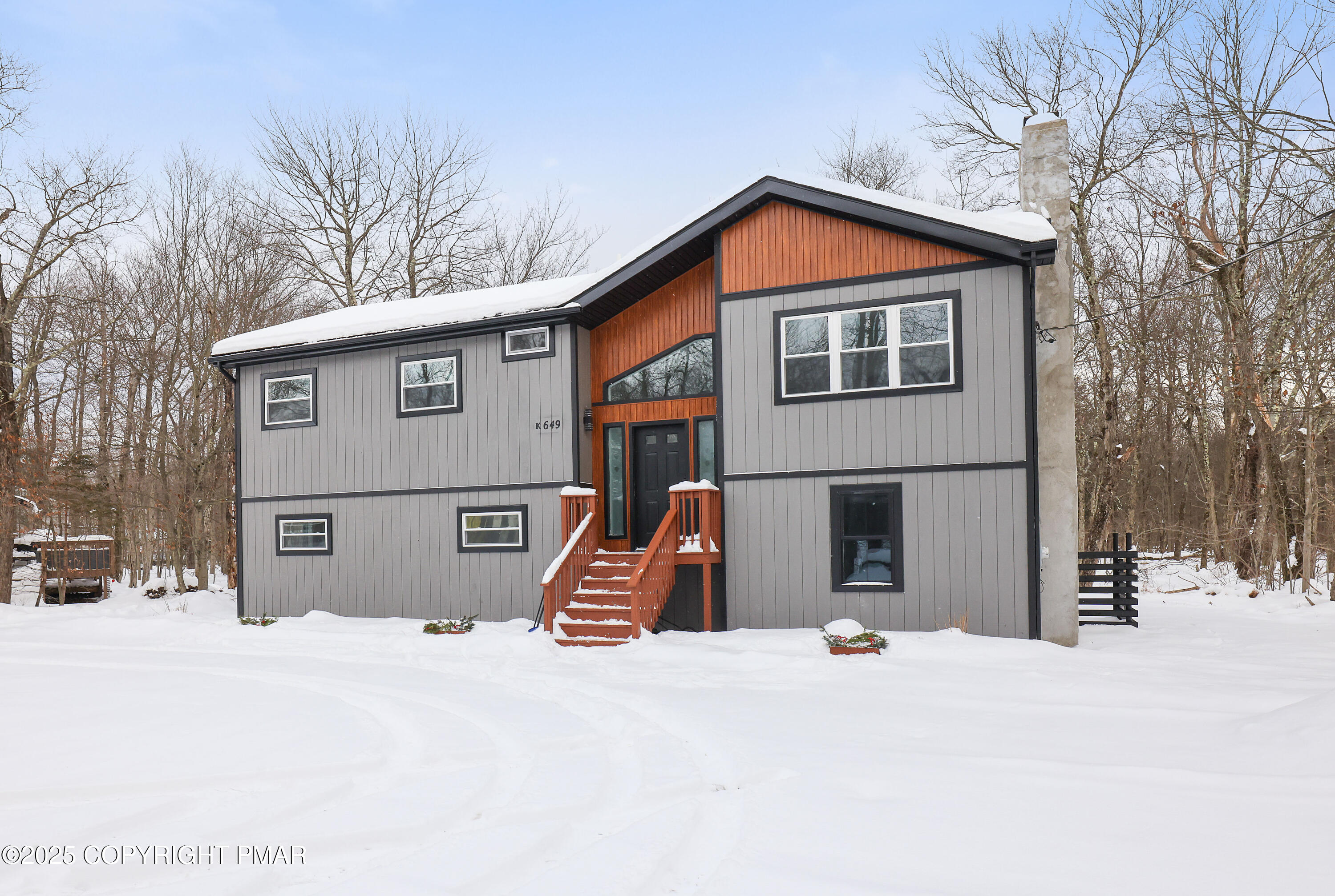 1254 Winding Way Tobyhanna, PA 18466 - Photo 3 of 46 a view of a house with a yard covered in snow