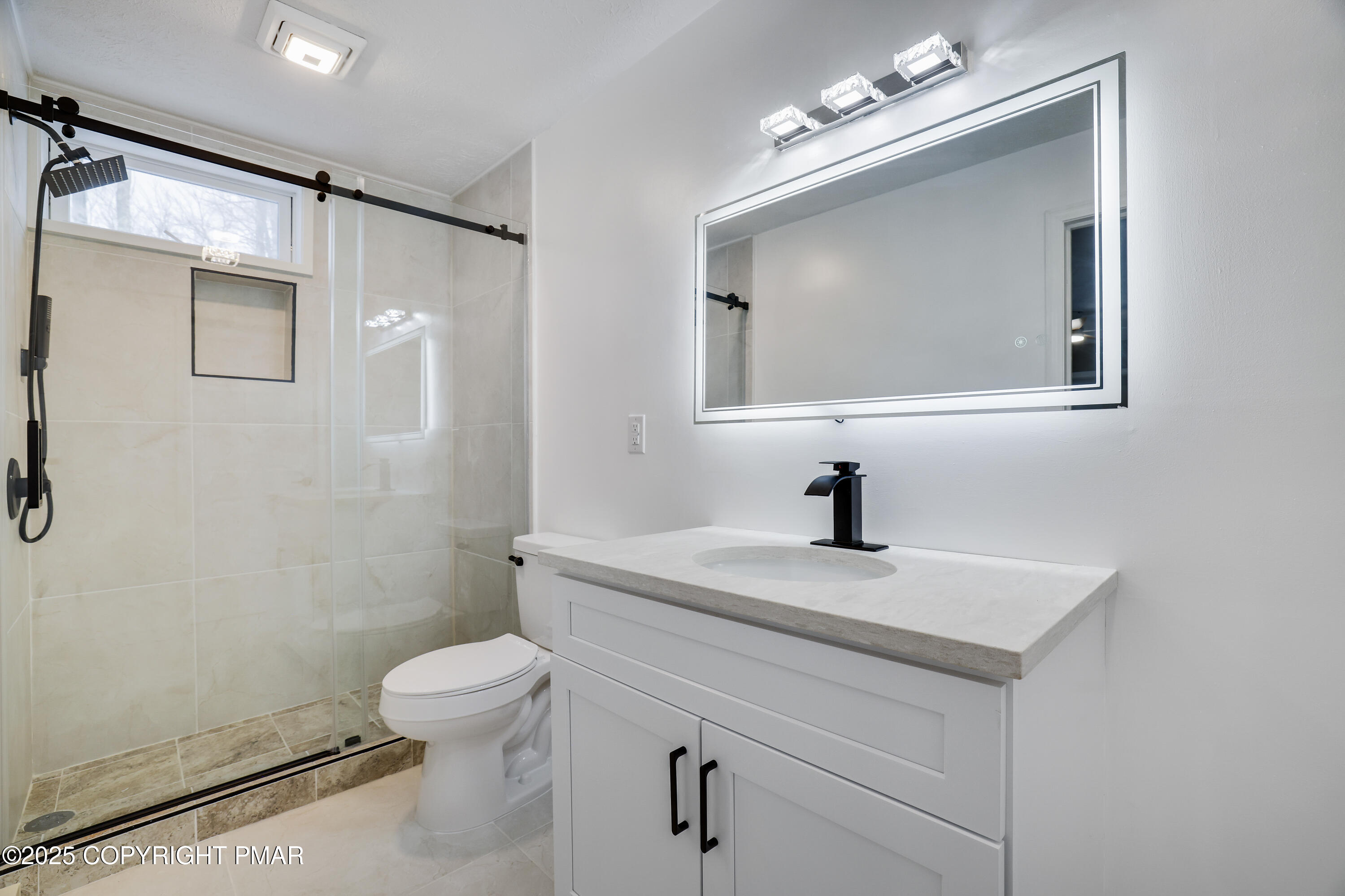 1254 Winding Way Tobyhanna, PA 18466 - Photo 31 of 46 a bathroom with a sink a toilet and a mirror