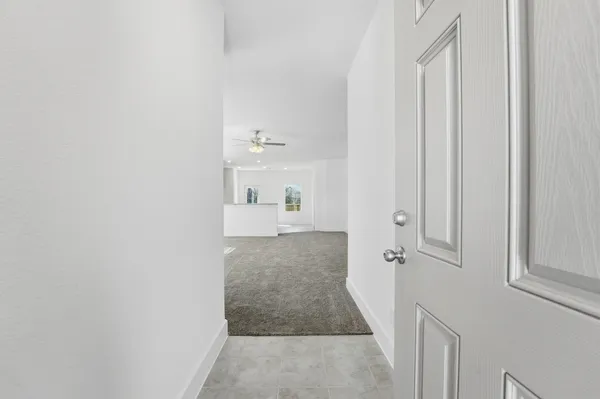 a view of a bathroom with white walls