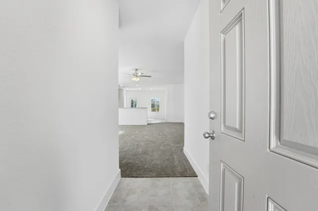 a view of a bathroom with white walls