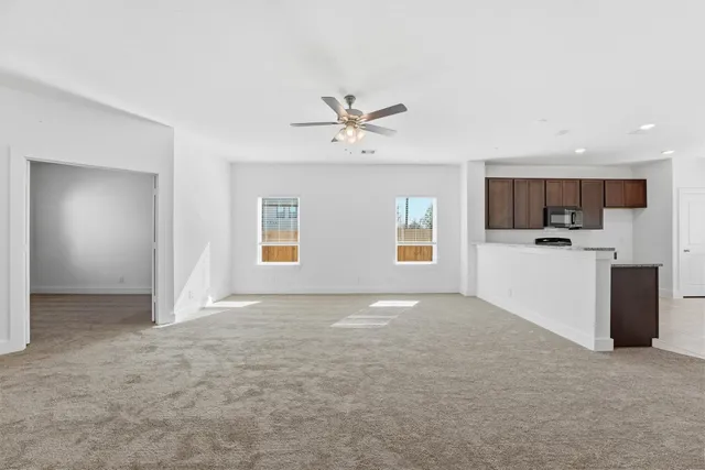 a view of a kitchen with a sink and a stove