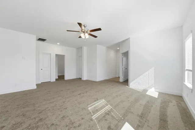 a view of a big room with carpet