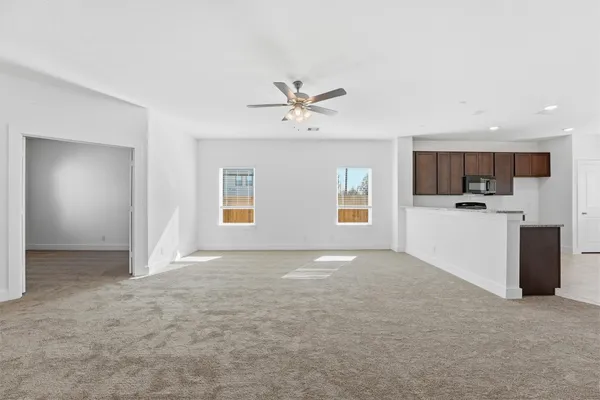 a view of a kitchen with a sink and a stove