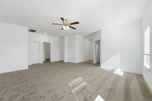 a view of a big room with carpet