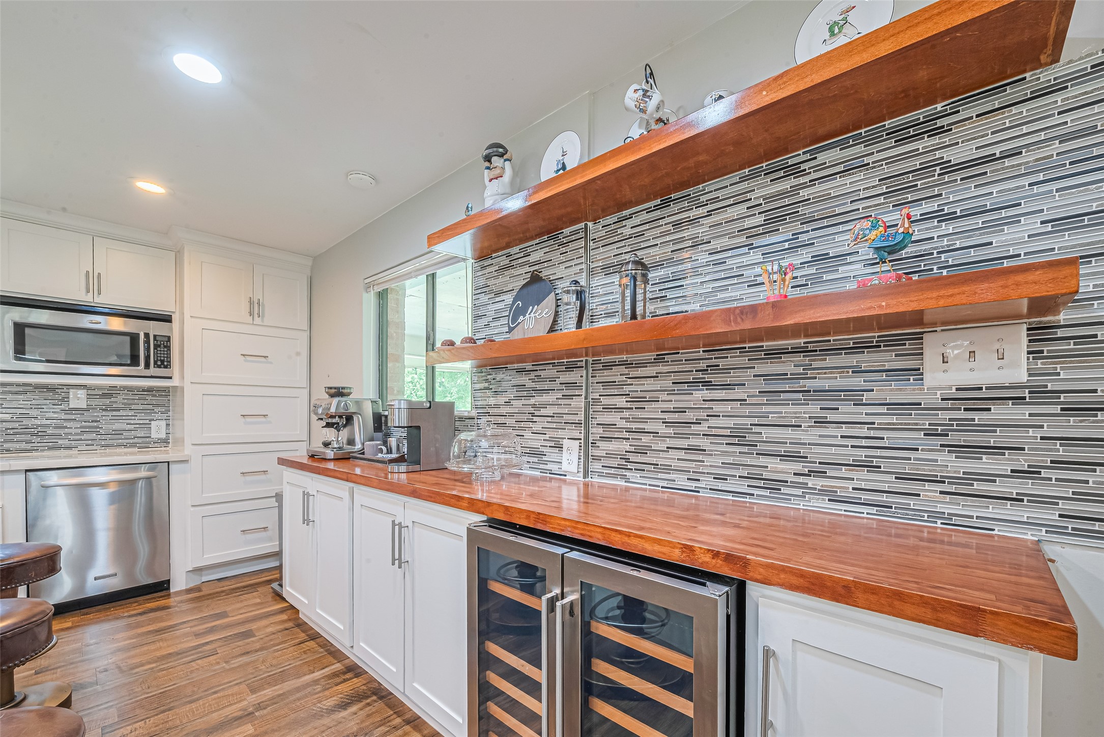 24314 Anderson Street Huffman, TX 77336 - Photo 21 of 48 a kitchen with stainless steel appliances a sink and cabinets