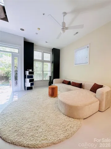 a bedroom with a large bed and a flat screen tv