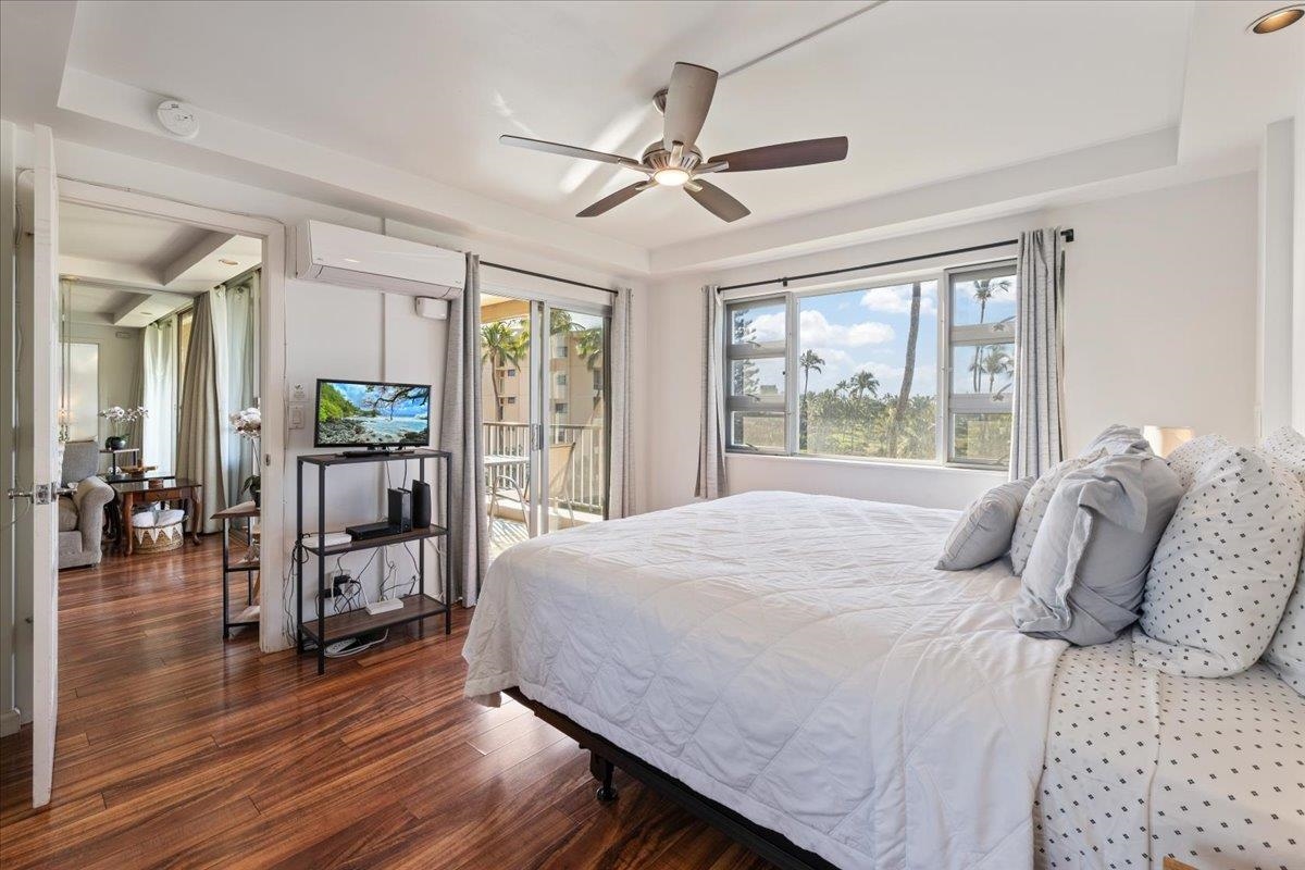 760 South Kihei Road, Unit 422 Kihei, HI 96753 - Photo 13 of 34 a bedroom with a bed and large windows