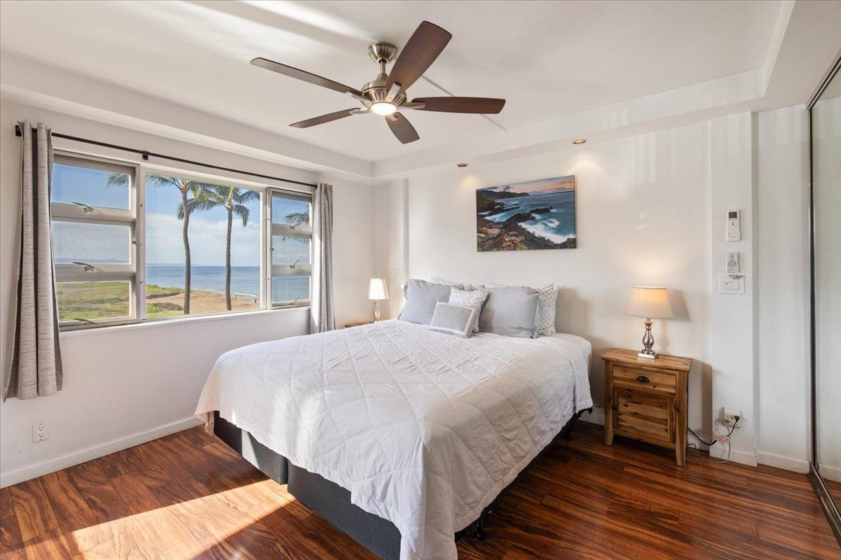 760 South Kihei Road, Unit 422 Kihei, HI 96753 - Photo 14 of 34 a bedroom with a large bed and a large window