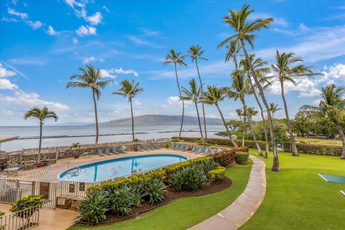 760 South Kihei Road, Unit 422 Kihei, HI 96753 - Photo 29 of 34 a view of a swimming pool with a table and chairs