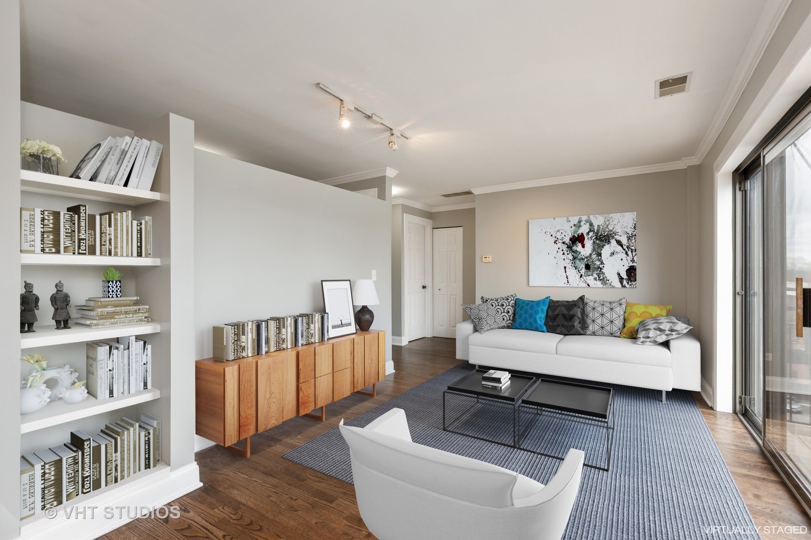 4144 North Sheridan Road, Unit 609 Chicago, IL 60613 - Photo 6 of 17 a living room with furniture and a book shelf