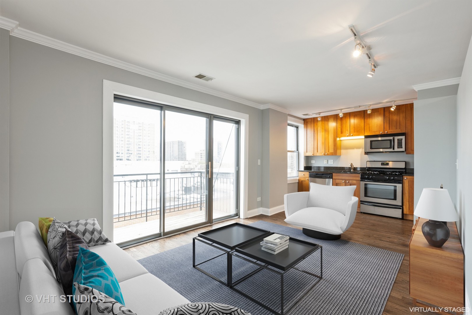 4144 North Sheridan Road, Unit 609 Chicago, IL 60613 - Photo 9 of 17 a living room with furniture and floor to ceiling windows