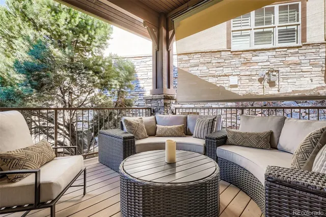 a balcony with furniture and outdoor view