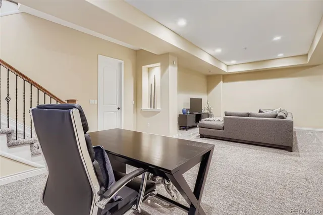 a living room with furniture wooden floor and a table