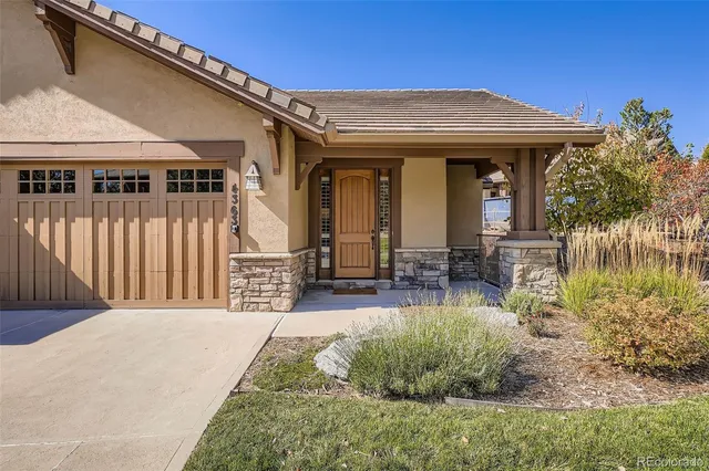 a front view of house with outdoor seating