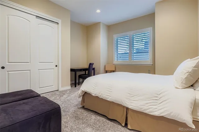 a bedroom with a bed and a table