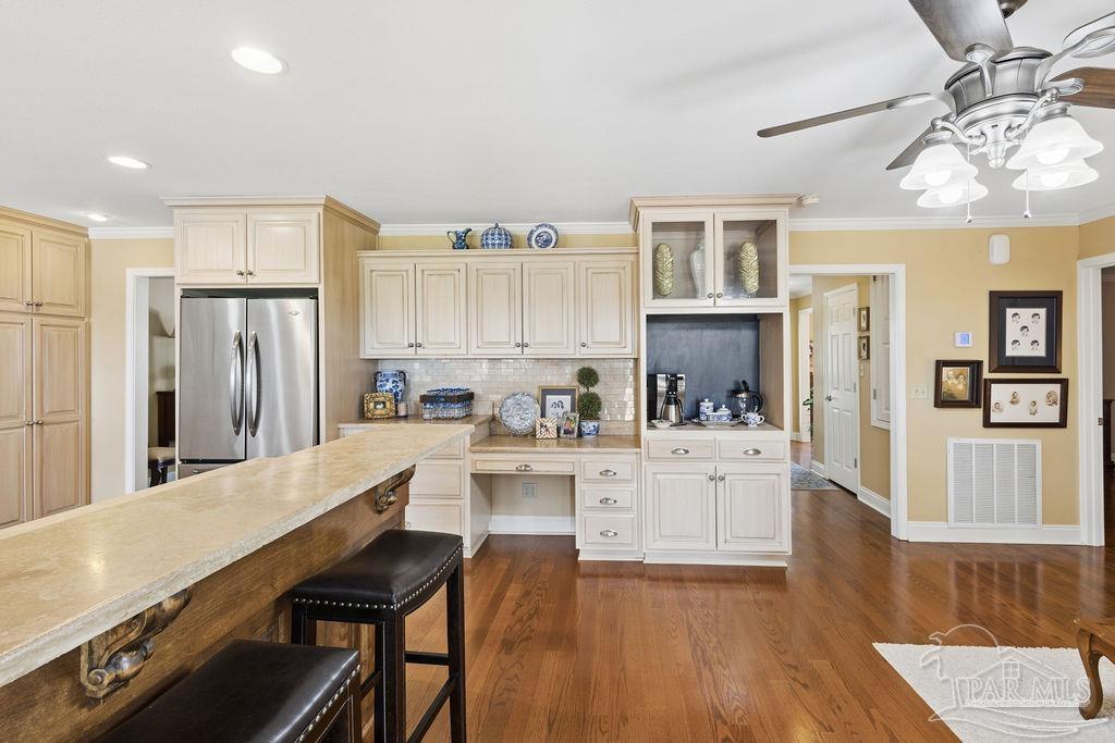 5160 Max Lane Jay, FL 32565 - Photo 13 of 54 a large kitchen with cabinets wooden floor and stainless steel appliances