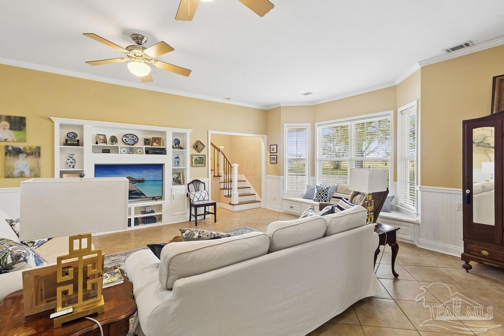 5160 Max Lane Jay, FL 32565 - Photo 24 of 54 a living room with furniture a large window and a flat screen tv
