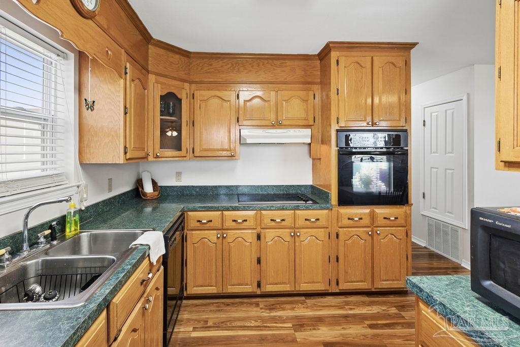 5160 Max Lane Jay, FL 32565 - Photo 35 of 54 a kitchen with stainless steel appliances granite countertop a sink and a stove