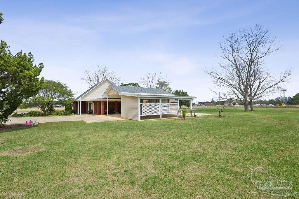 5160 Max Lane Jay, FL 32565 - Photo 48 of 54 a front view of a house with a garden