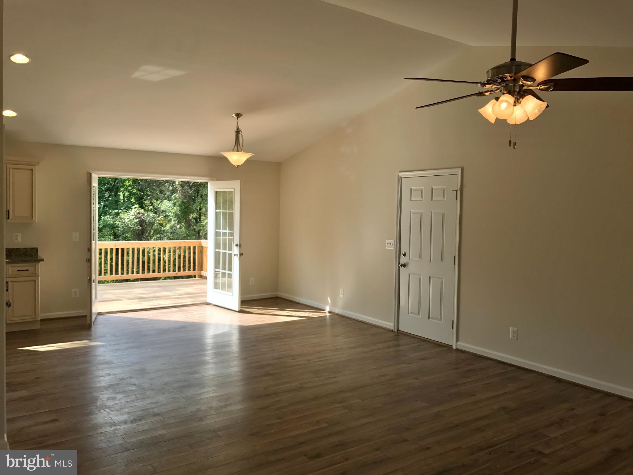 198 Heim-Jones Road Linden, VA 22642 - Photo 12 of 38 a view of an empty room with wooden floor and a window