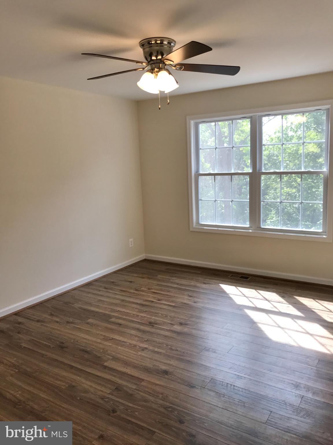 198 Heim-Jones Road Linden, VA 22642 - Photo 20 of 38 a view of an empty room with wooden floor and a window