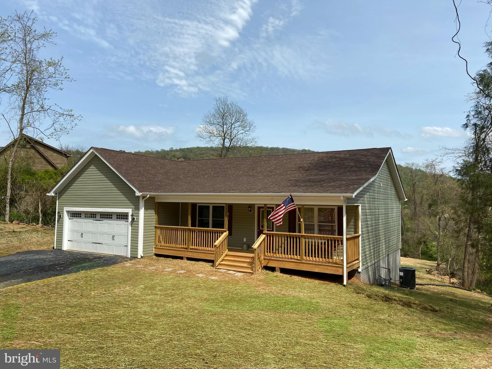 198 Heim-Jones Road Linden, VA 22642 - Photo 2 of 38 a front view of a house with a yard