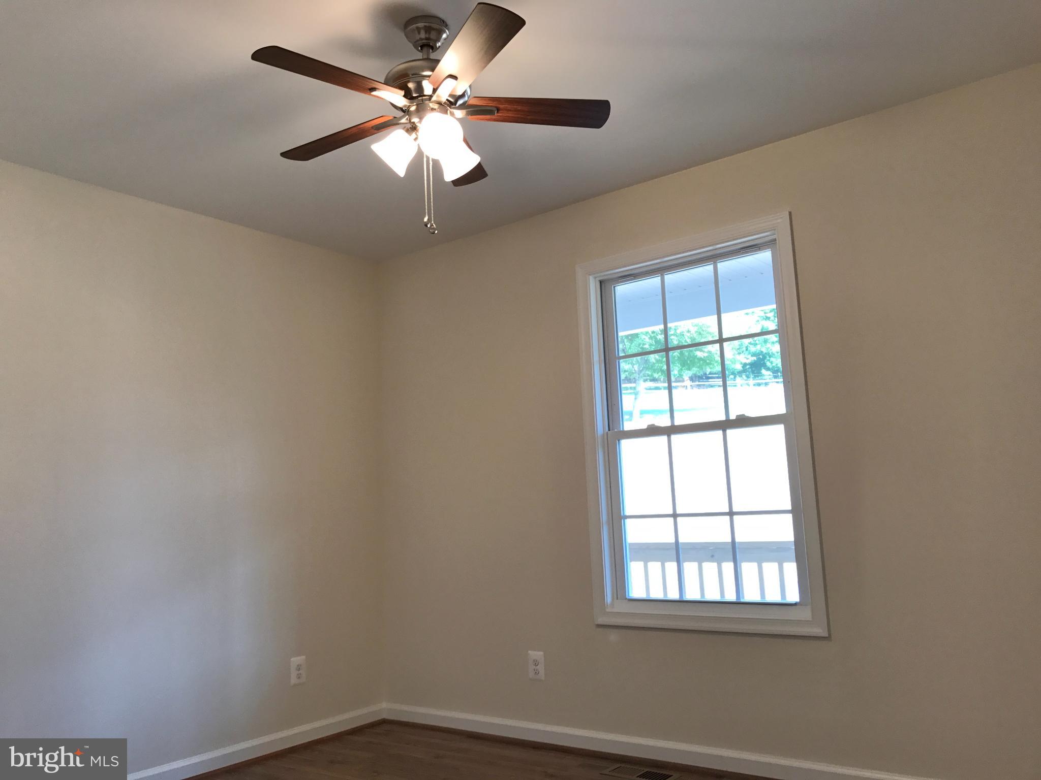 198 Heim-Jones Road Linden, VA 22642 - Photo 22 of 38 an empty room with a window and a fan