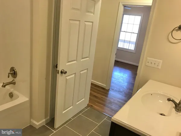 a bathroom with a sink and a tub