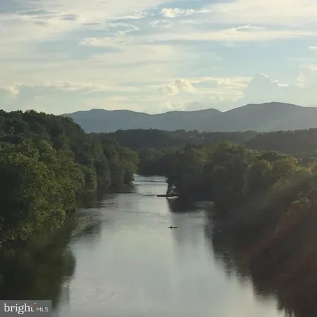 a view of lake with mountain