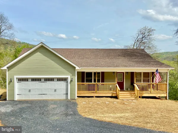 a view of house with yard