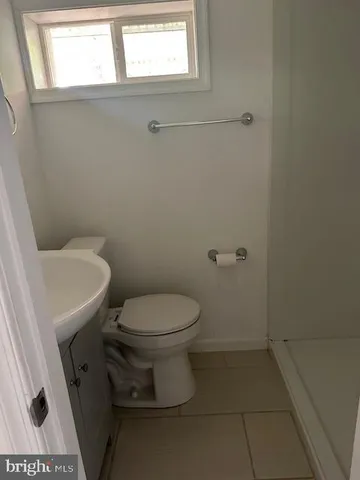 a bathroom with a toilet and a sink