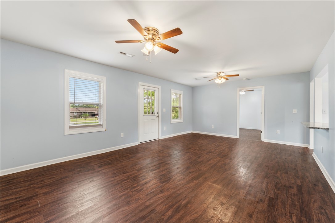 104 Leah Drive Pendleton, SC 29670 - Photo 7 of 23 This airy living space features rich wood flooring and abundant natural light.
