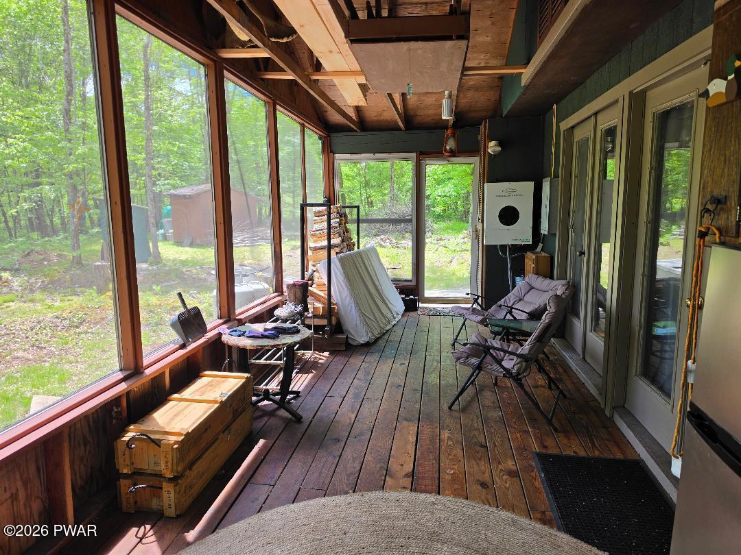 94 Swamp Road Pleasant Mount, PA 18453 - Photo 5 of 33 a view of living room with furniture and floor to ceiling windows