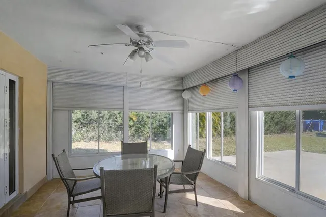 a view of a dining room with furniture window and outside view
