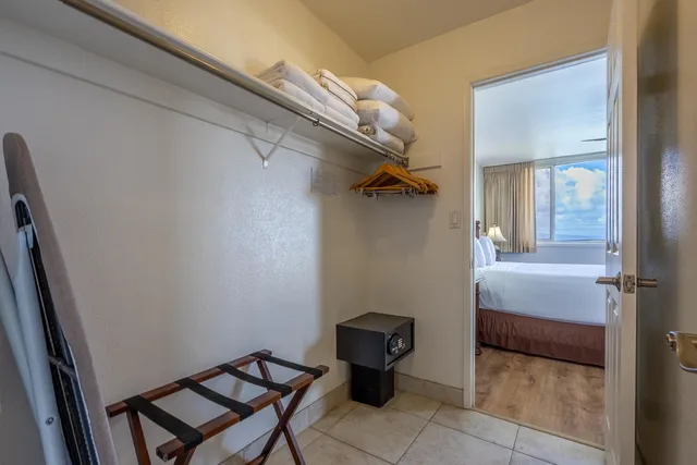 a view of a hallway and an empty room